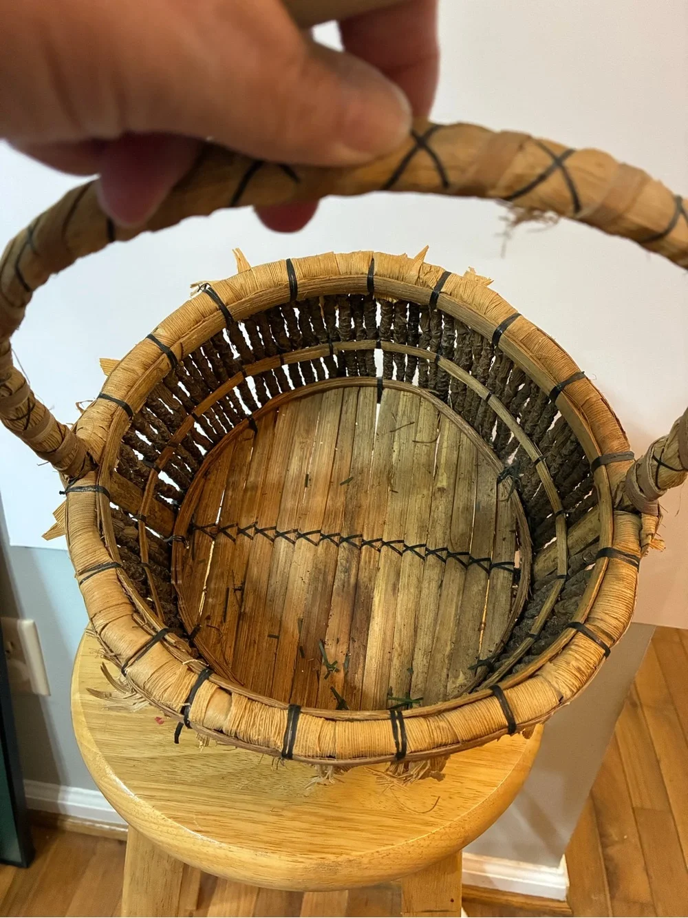 Handcrafted rustic corn husk and twig folk art basket